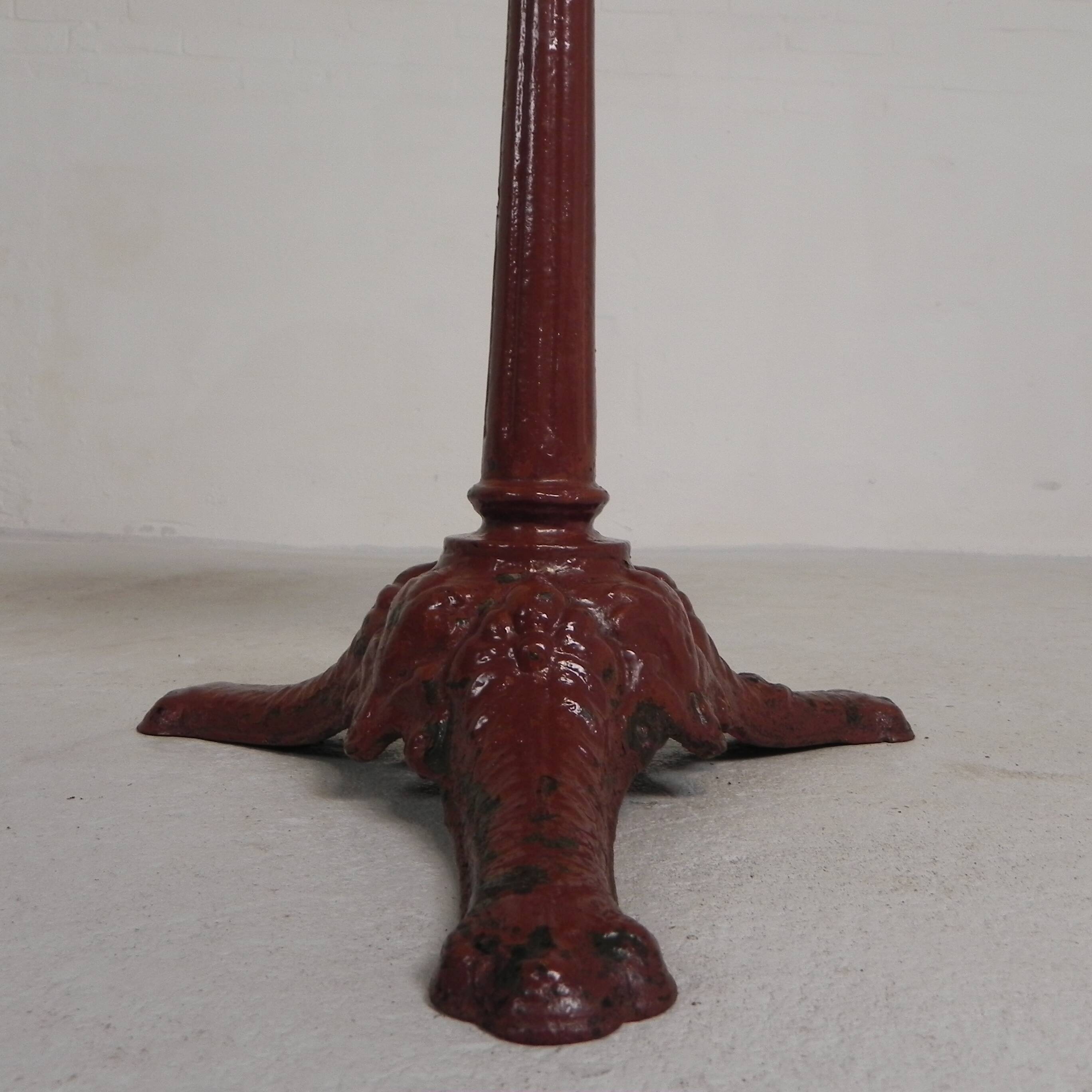 Bistro table with cast iron legs and marble top, 1920s.