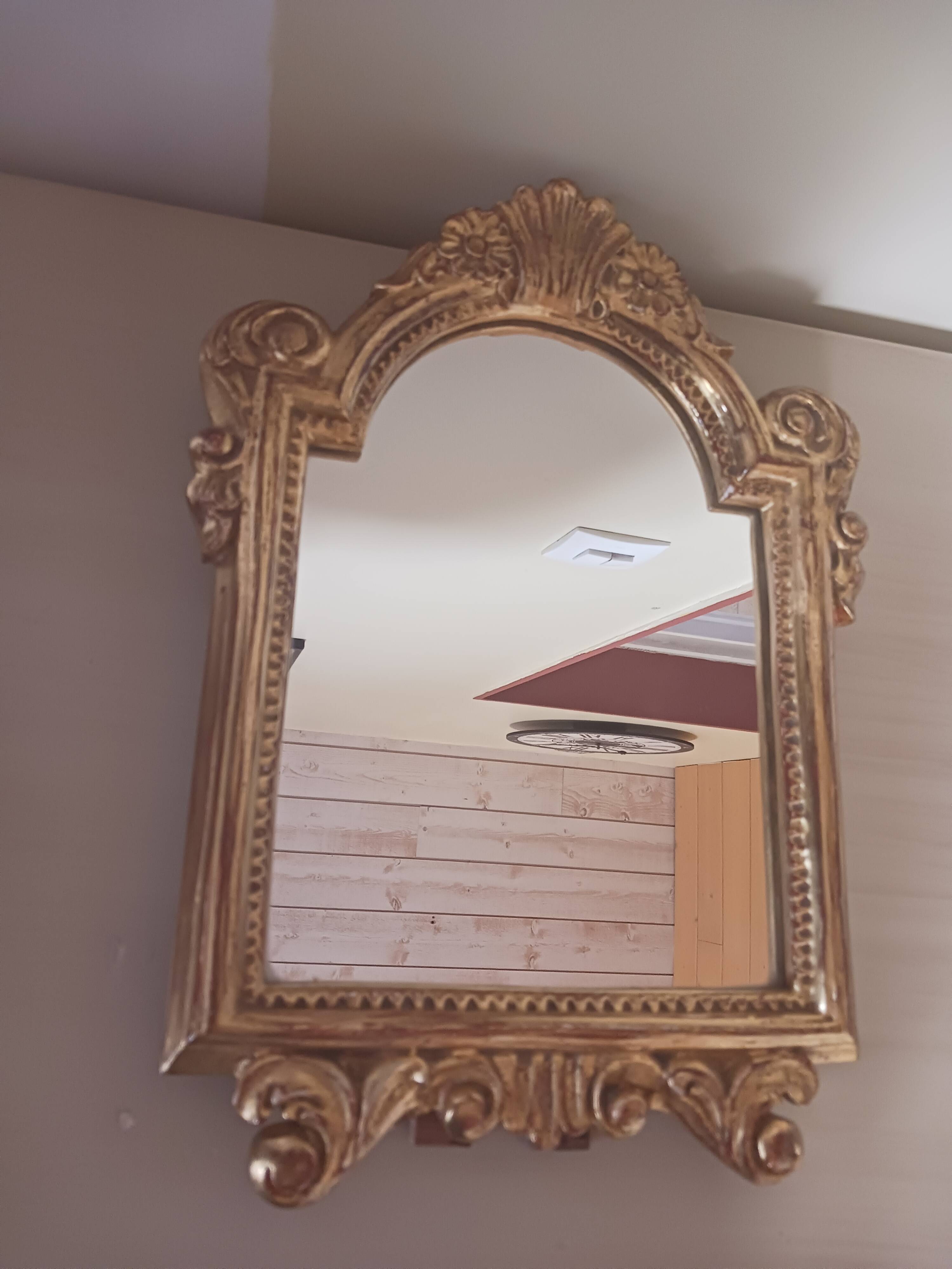 Antique mirror in gilded wood.