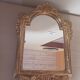 Antique mirror in gilded wood.