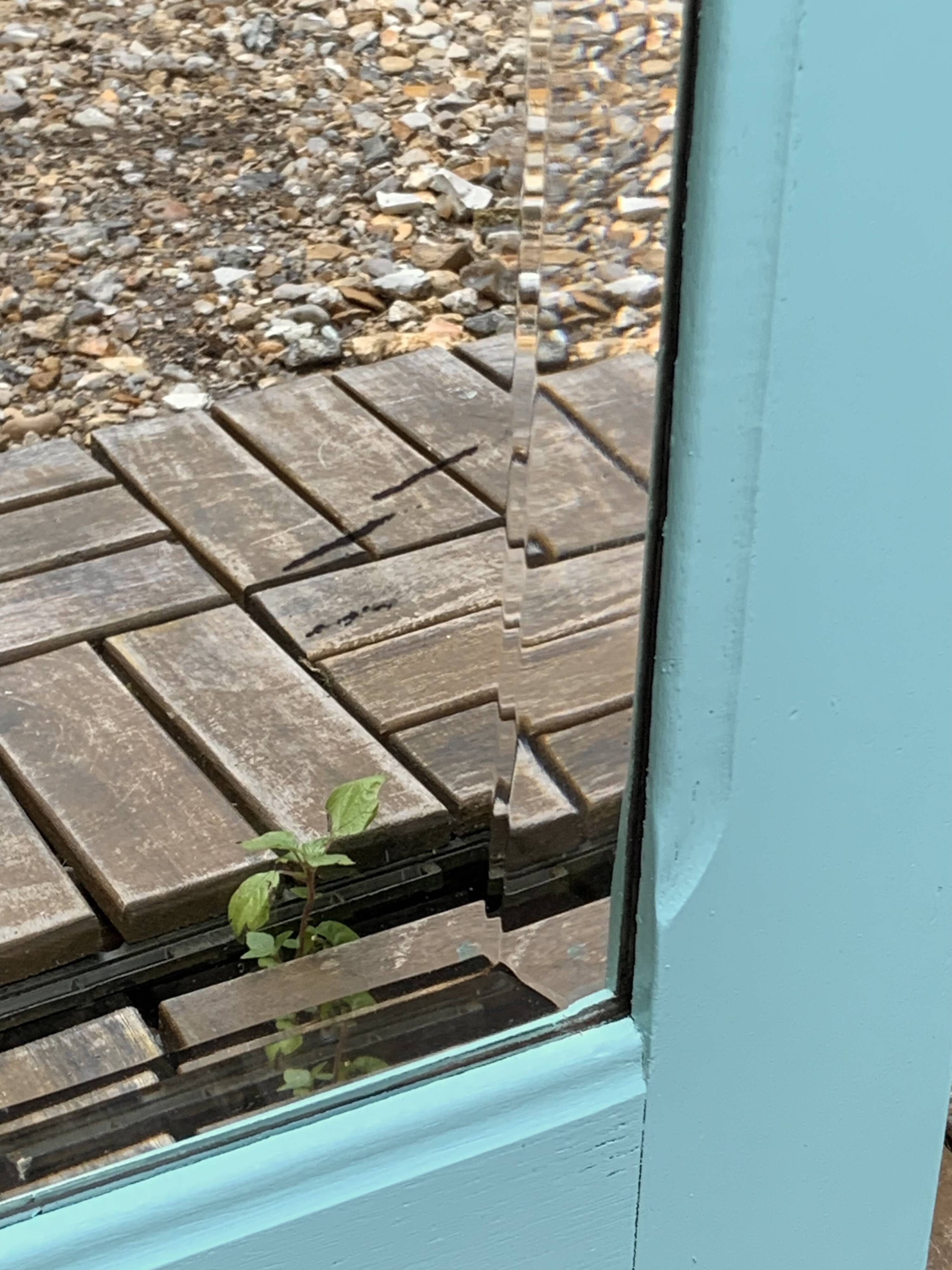 Beveled mirror on turquoise Parisian door