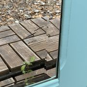 Beveled mirror on turquoise Parisian door