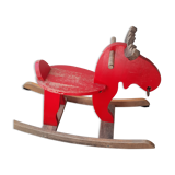 Old reindeer with wooden rocking