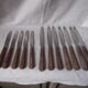 Set of knives with brown Bakelite handles.