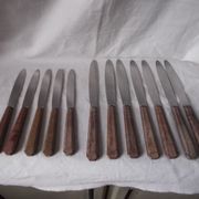 Set of knives with brown Bakelite handles.
