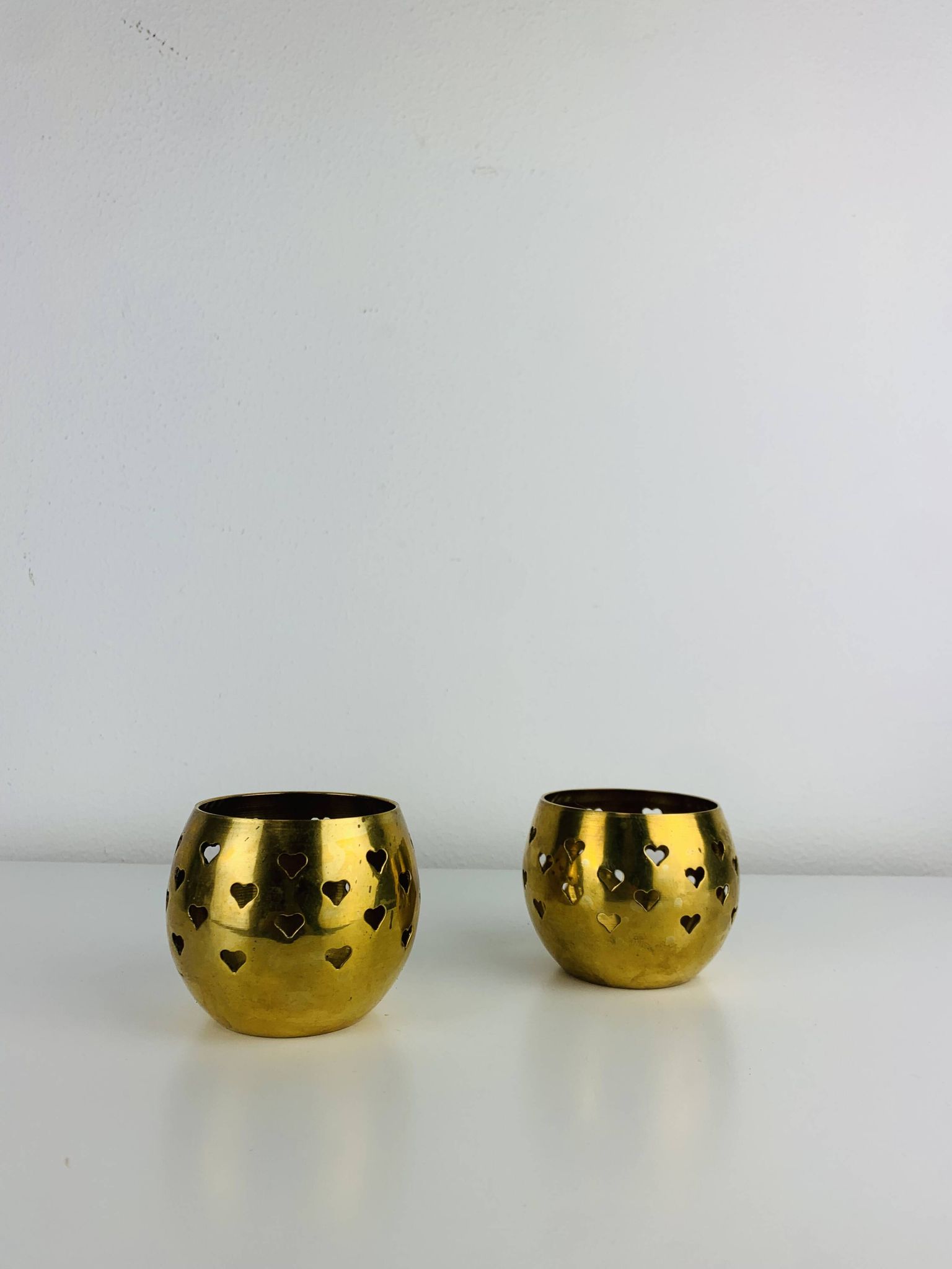 Pair of vintage openwork brass candle holders/votive candlesticks, gilded