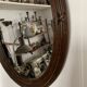 Miroir ovale ancien en bois sculpté et noeud de style Louis XVI