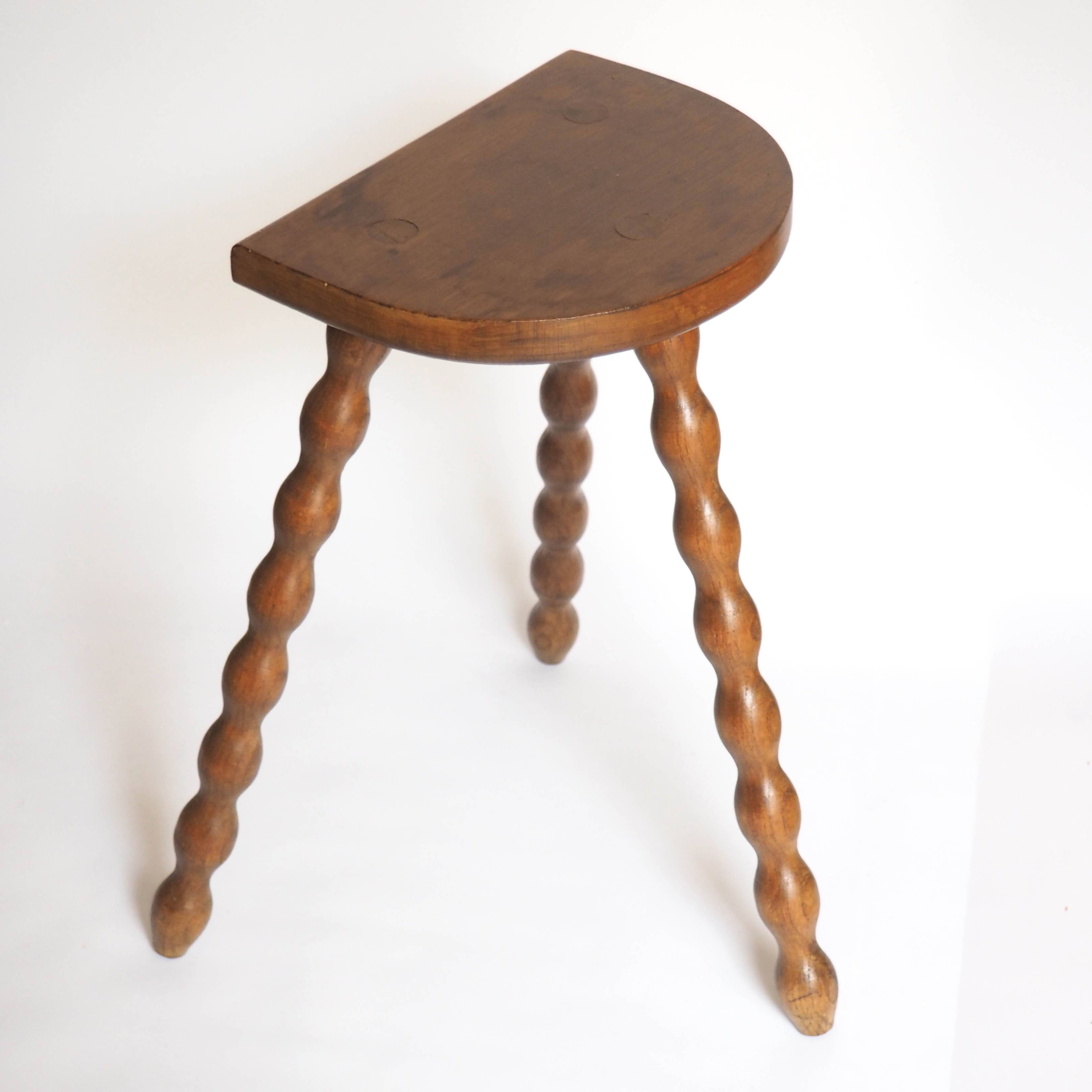 High tripod stool in turned wood