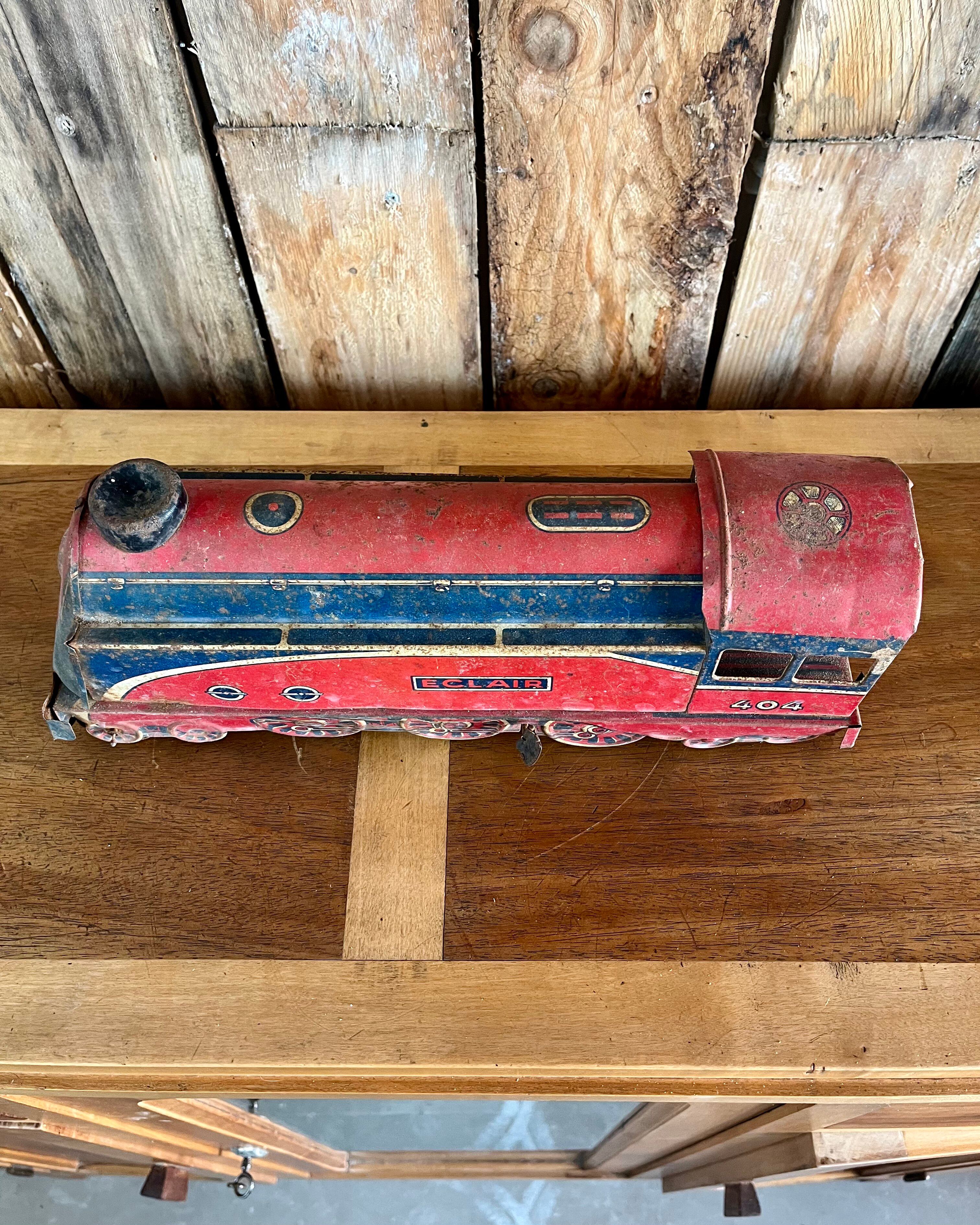 Old tin locomotive Eclair 404