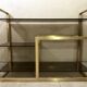 Console / étagère vintage en laiton doré et verre fumé des années 50