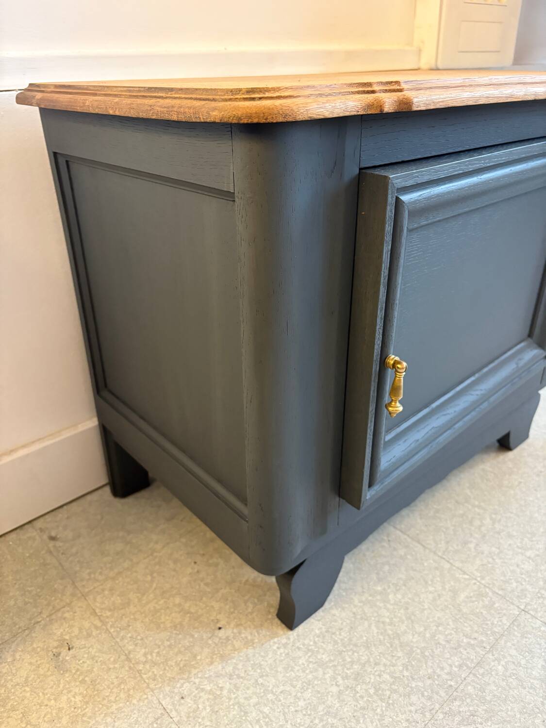 Mat black storage furniture, natural top.