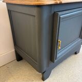 Mat black storage furniture, natural top.