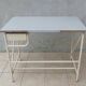 Industrial high table made of metal and formica.