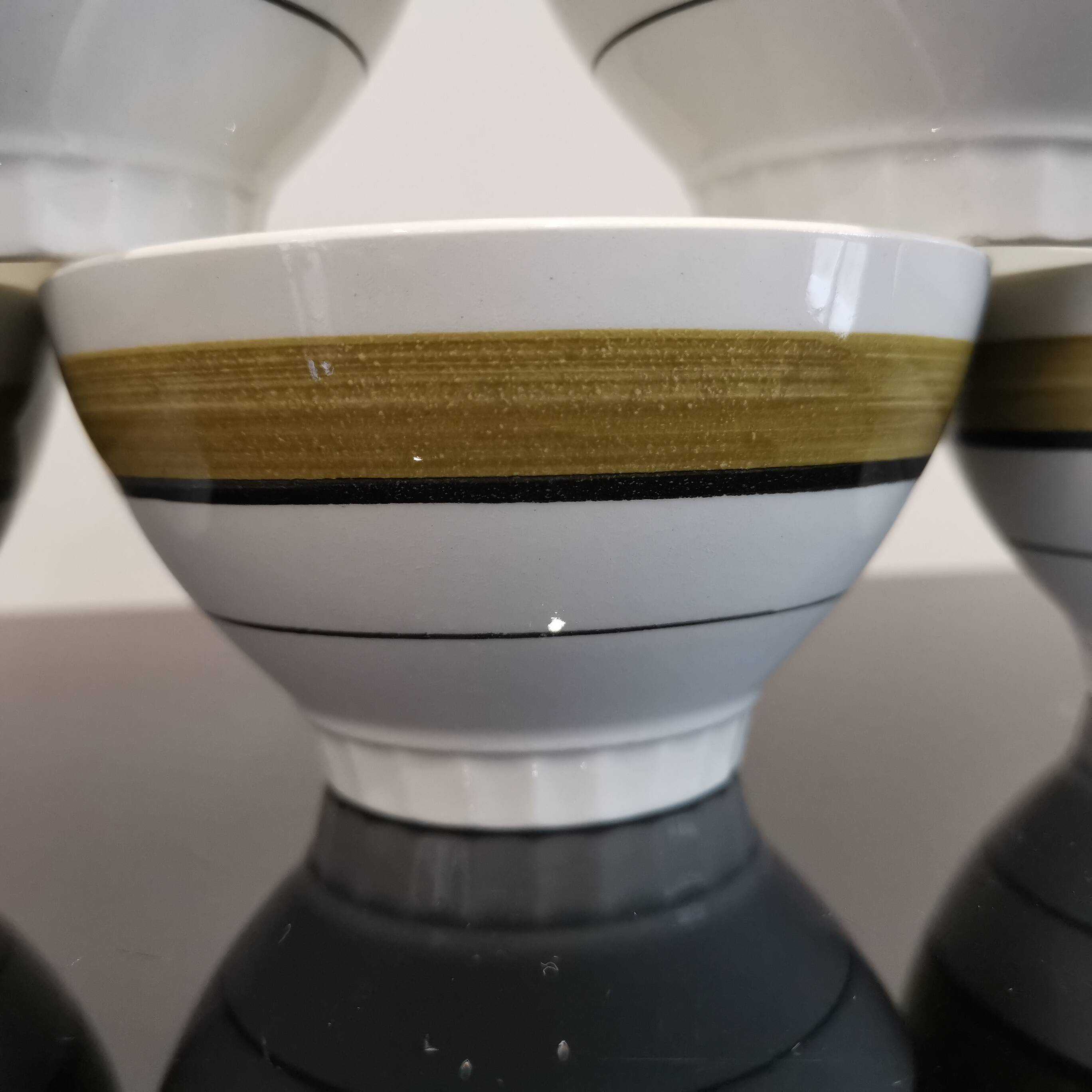 Series of 5 small old earthenware bowls with olive green edging