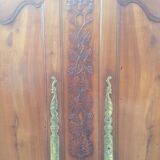 Louis XV Nantaise wardrobe carved with grape clusters, cherry gendarme hat at the end of the 19th century.