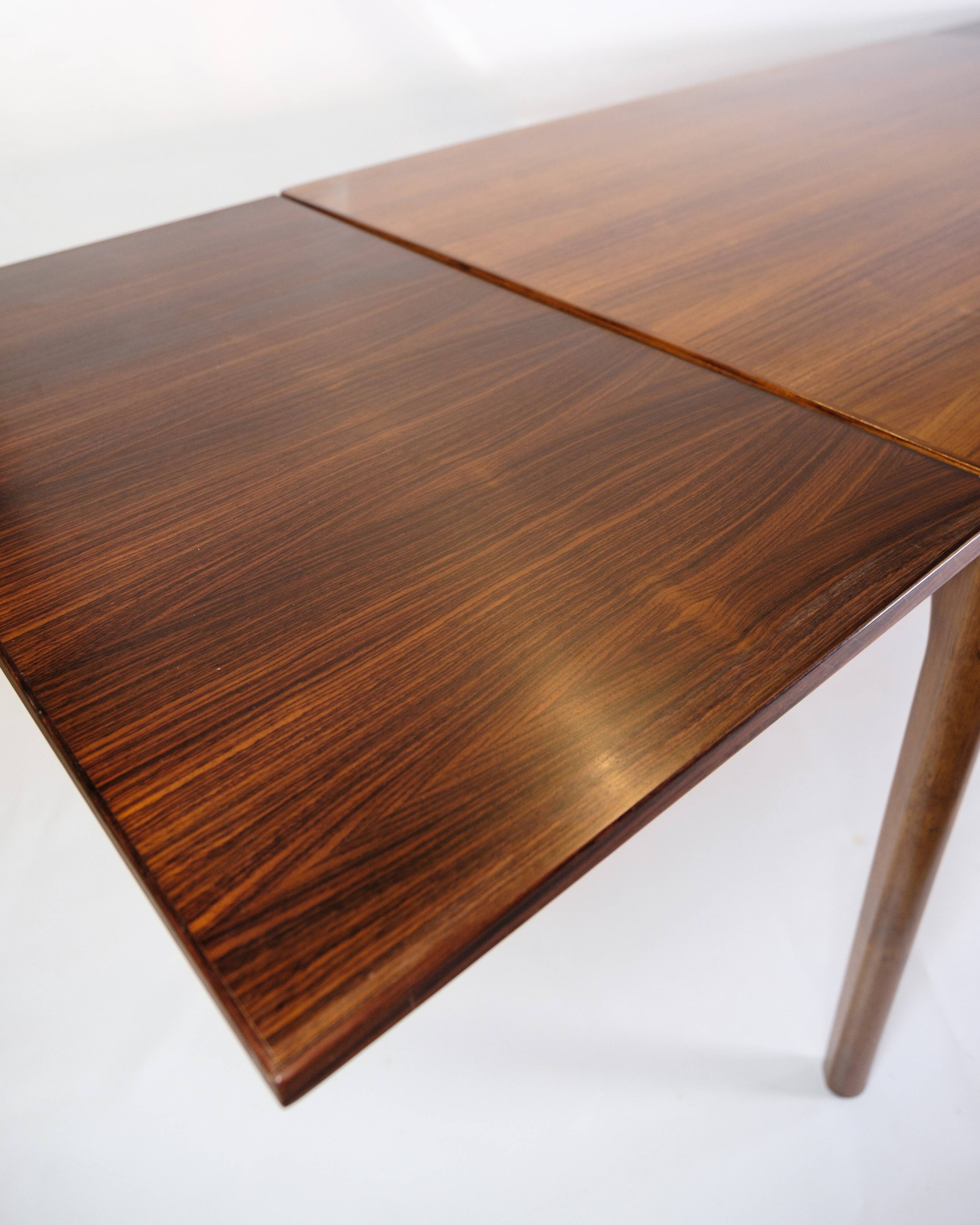 Dining Table With extensions Made In Rosewood By Henning Kjærnulf From 1960s