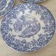 4 earthenware plates with floral and pastoral scene motif