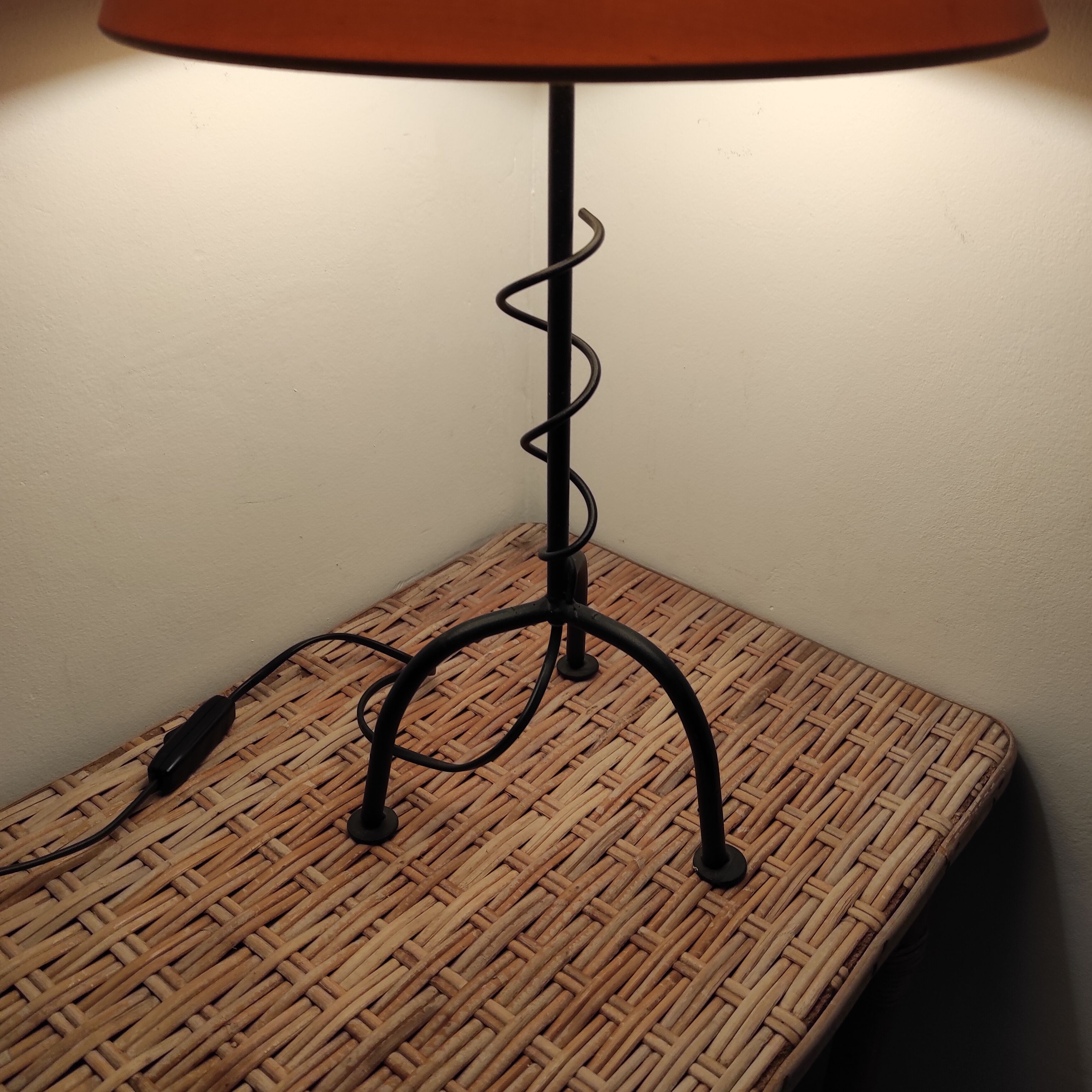 Black wrought iron table lamp and beige lampshade