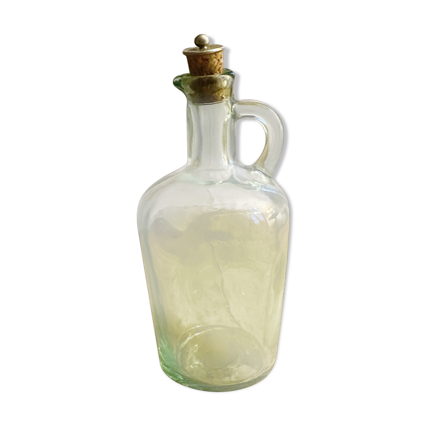 Green pitcher made of vintage glass