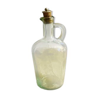 Green pitcher made of vintage glass