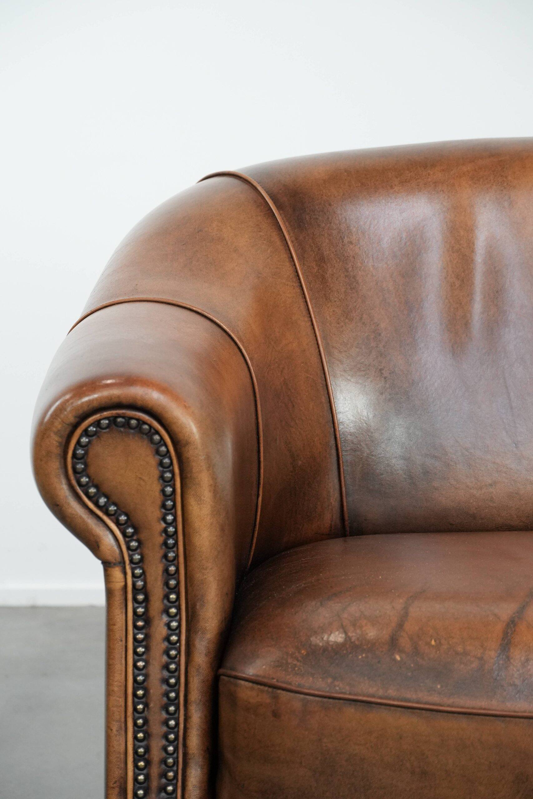 Characterful vintage sturdy 2-seater club sofa made of sheepskin leather