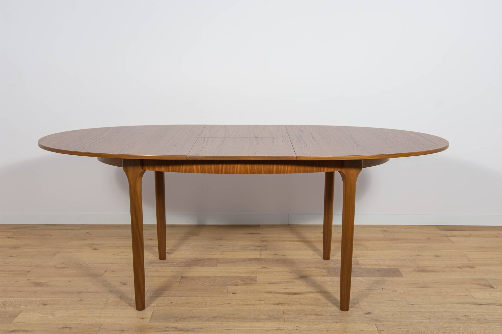 Mid-century extendable oval teak dining table from McIntosh, UK