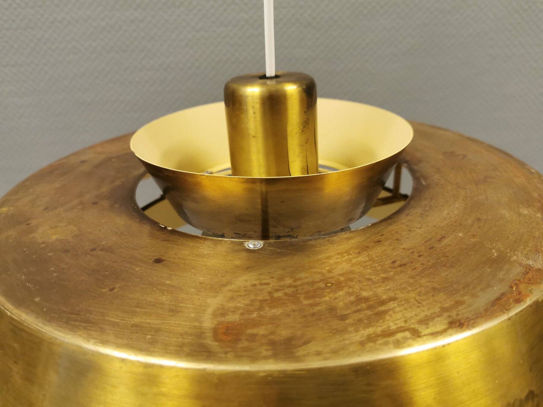 A mid-century Danish hanging lamp in solid brass by Jo Hammerborg for Fog & Mørup.