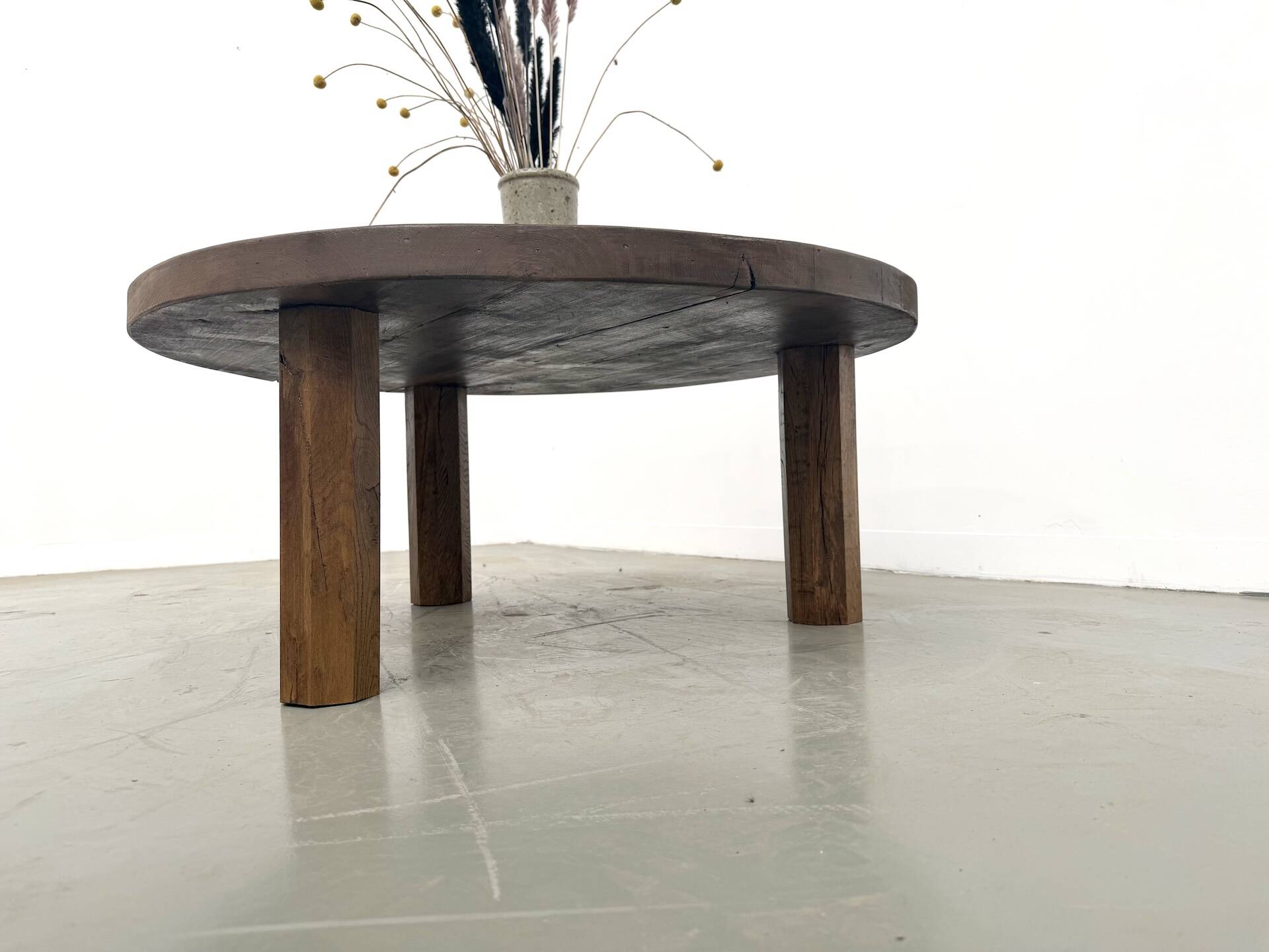 Round coffee table in solid oak, octagonal legs, France, 1950s.