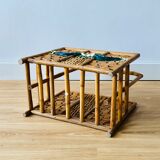 Vintage rattan magazine holder with floral decoration