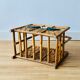 Vintage rattan magazine holder with floral decoration
