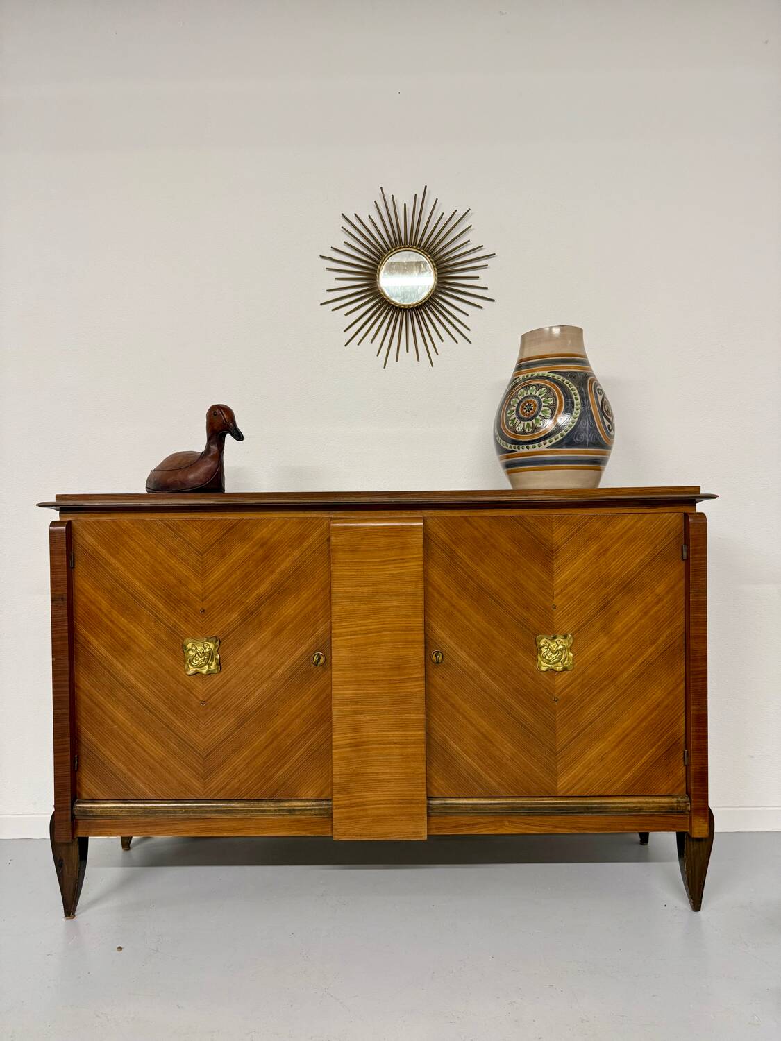 Antique art deco sideboard from the 1930s with veneered wood and bronze insert