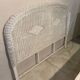 White rattan bedroom set: chest of drawers, mirror, bed, basket