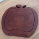 Foldable fruit basket in the shape of an apple.