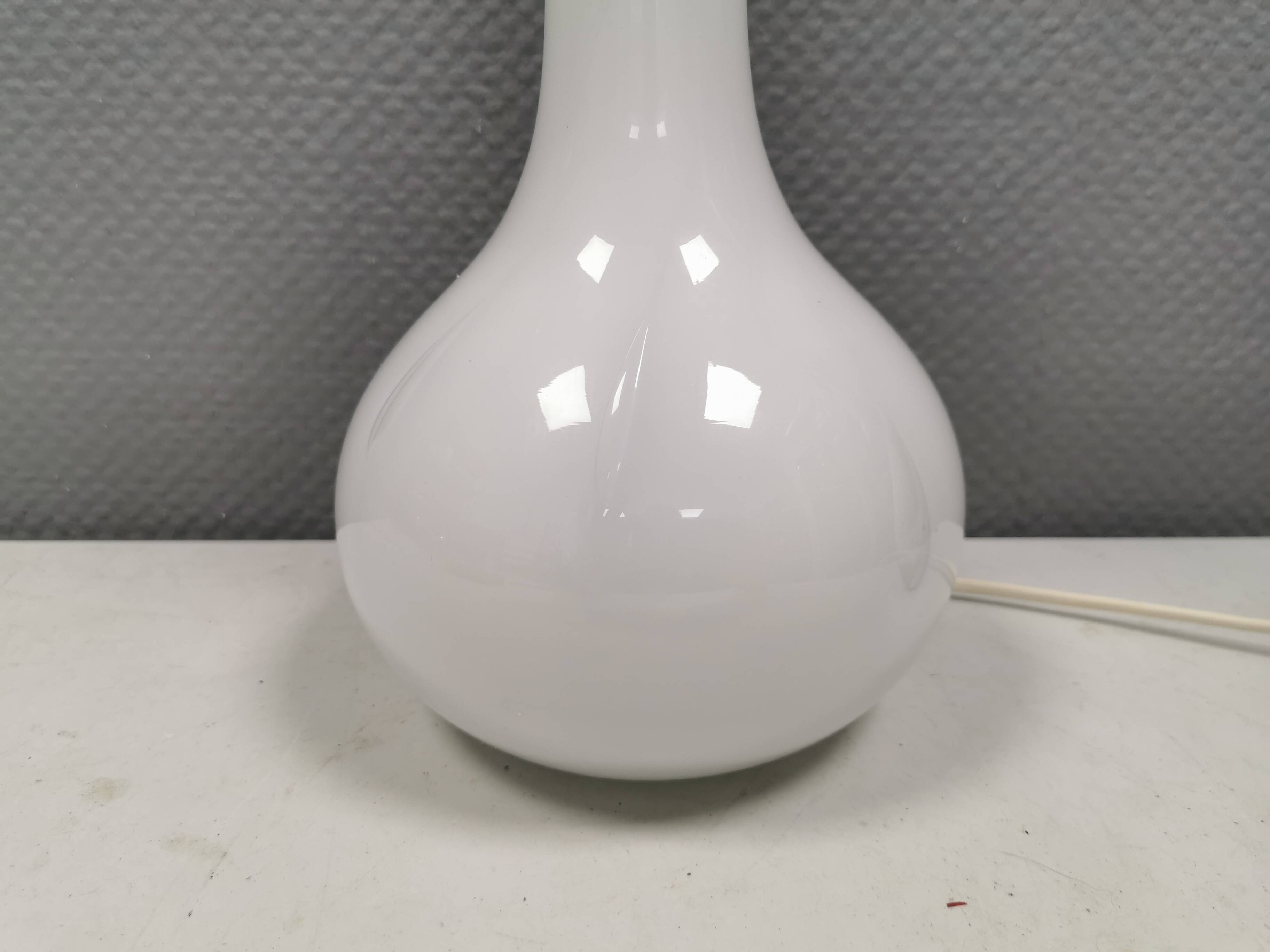 Helios table lamp, teardrop shaped, made of white opal glass. 1986 Denmark