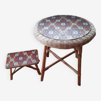Rattan table and its small bench