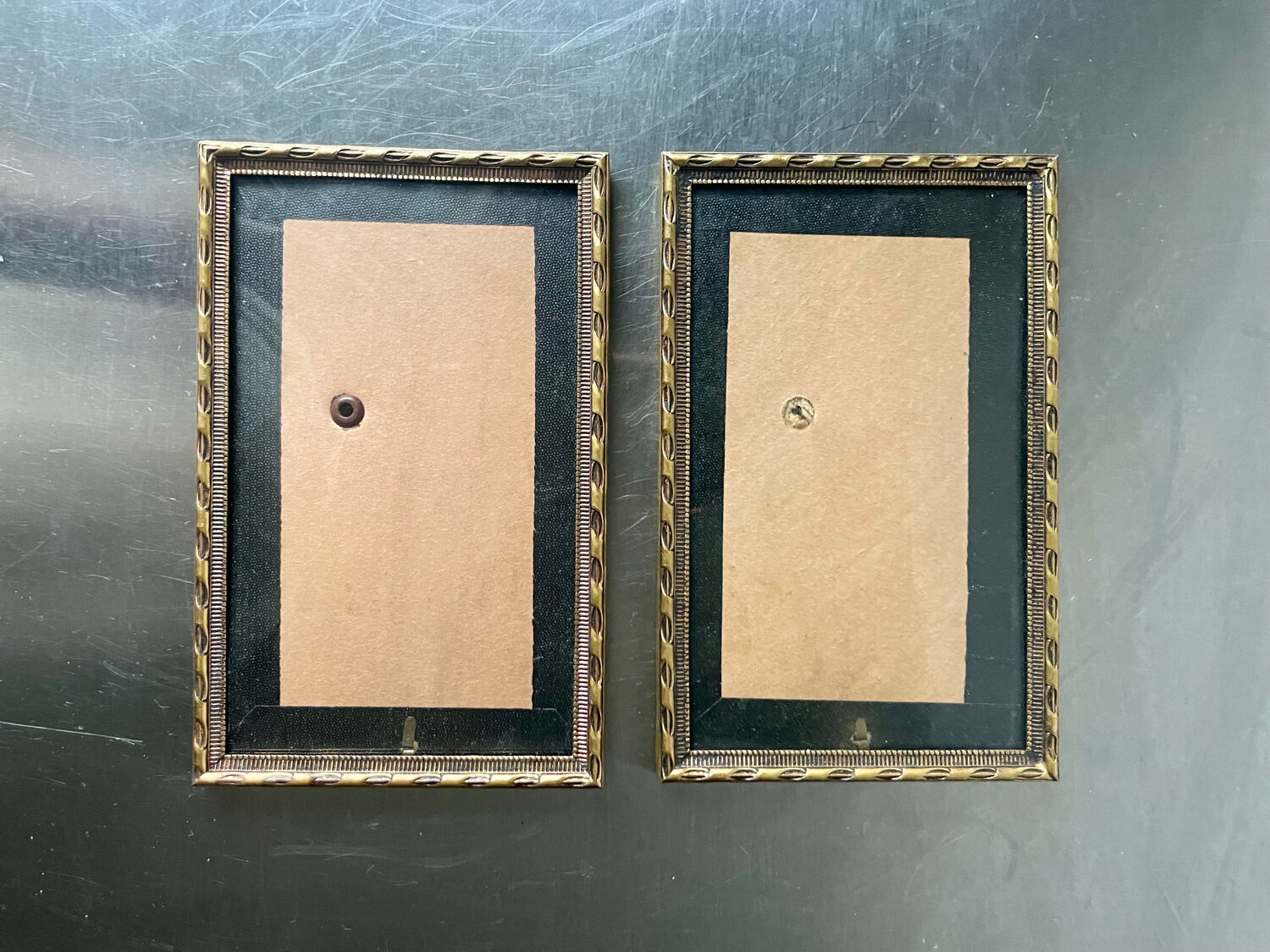 Pair of identical gold colored metal frames each measures  14.5 cm x 9 cm convex glass