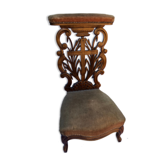 Low armchair in carved wood
