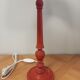 Red patinated wooden lamp