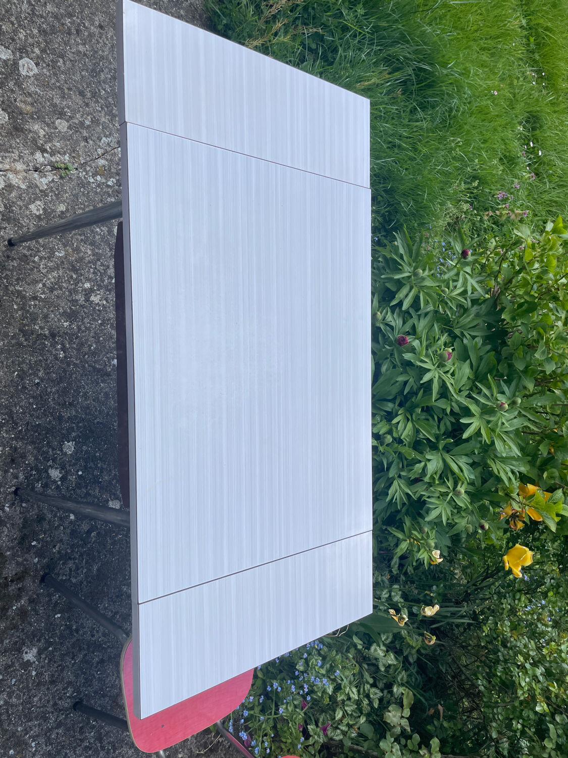 Formica table with a red Mid-century chair.
