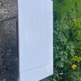 Formica table with a red Mid-century chair.