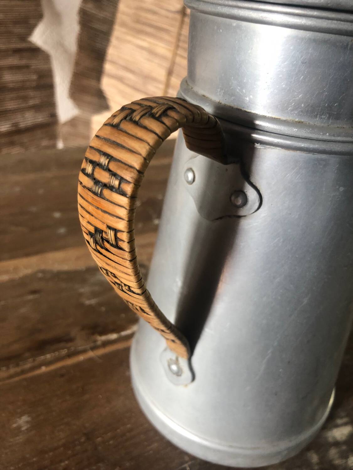 Old aluminum coffee maker, woven wicker handle