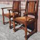 Pair of oak armchairs with straw seats and backs.