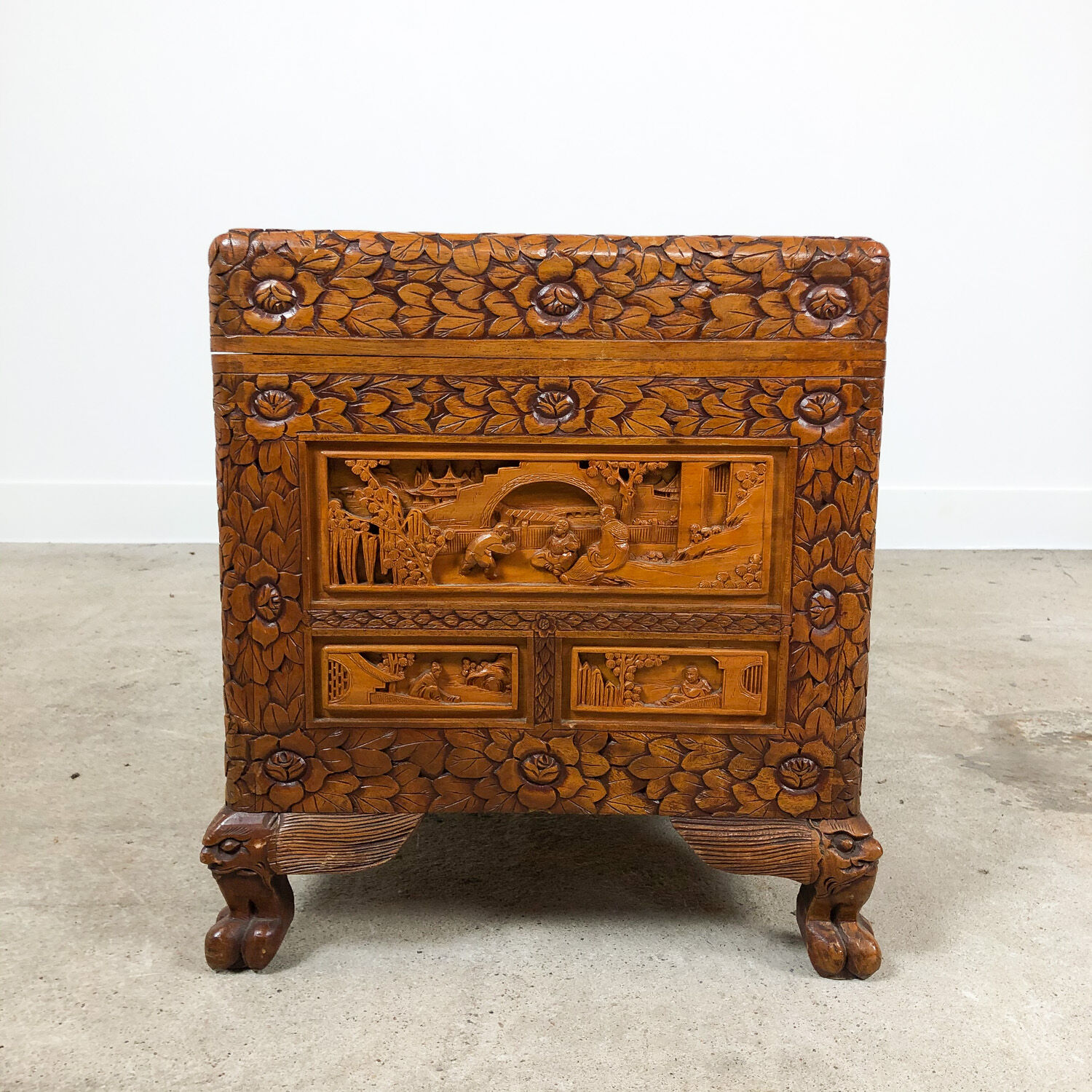 Vintage Chinese carved camphor wood chest on claw feet