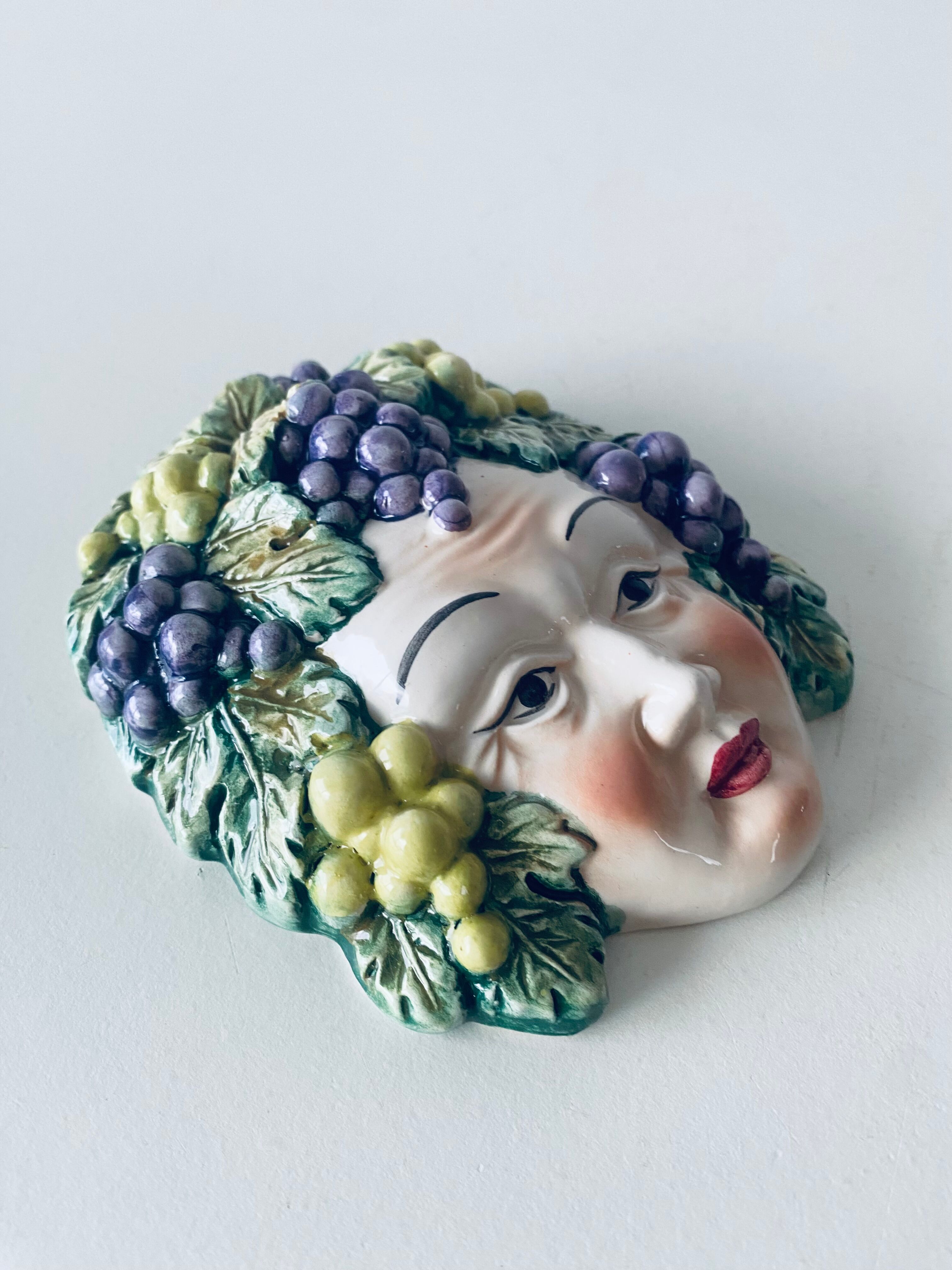 Ceramic wall face signed Il Falco