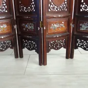Asian screen in carved wood and mother-of-pearl marquetry.