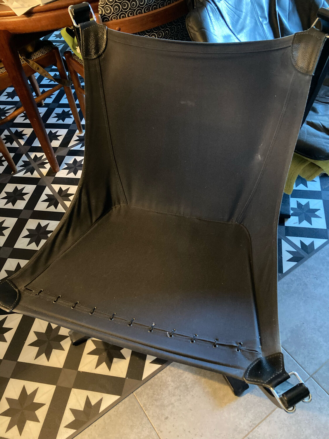 Leather Falcon armchair and footrest
