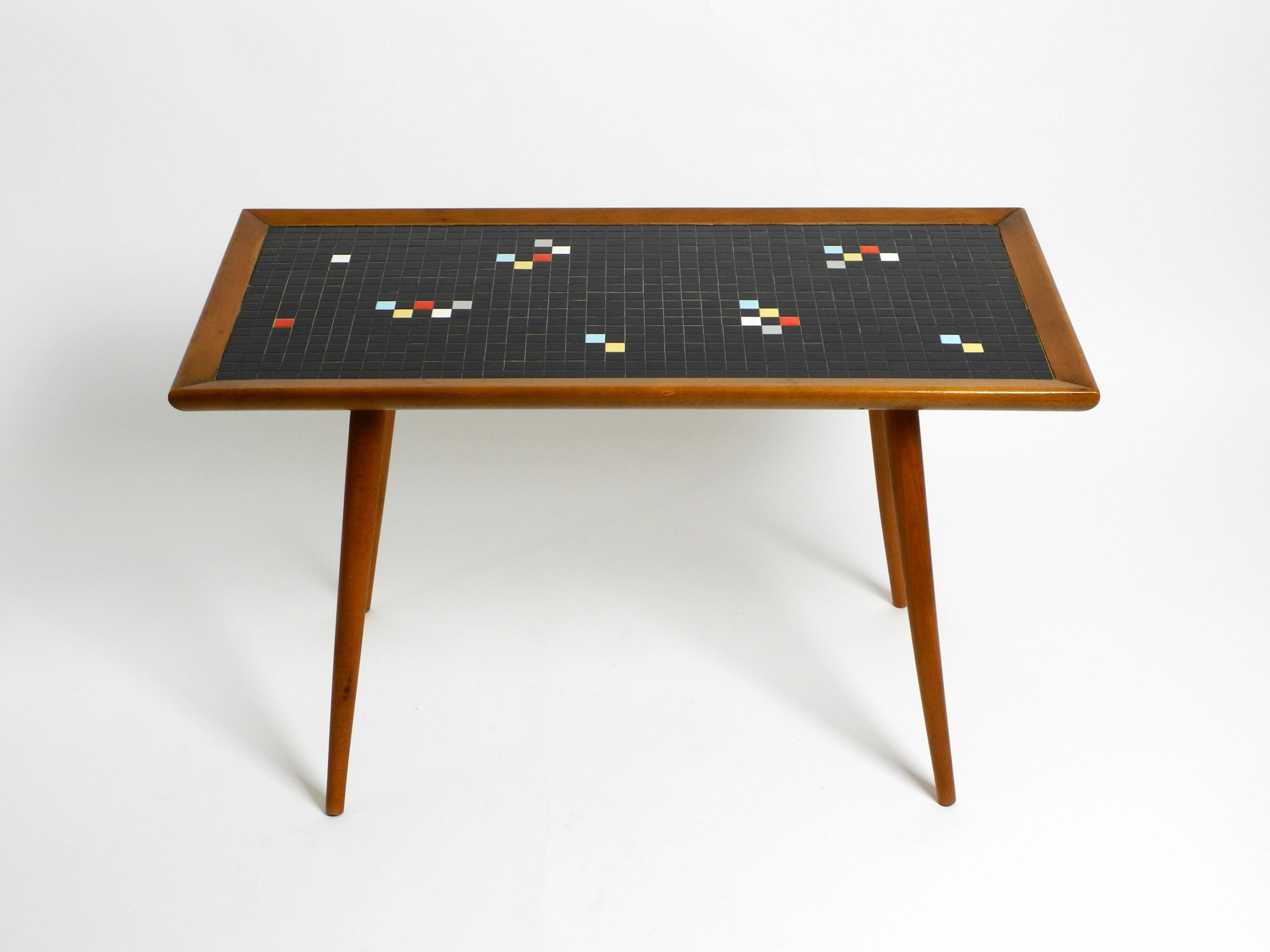 Beautiful long Mid Century walnut wood coffee table with a mosaic surface