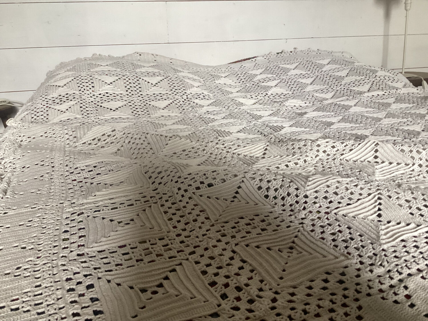 White cotton crochet bedspread with squares