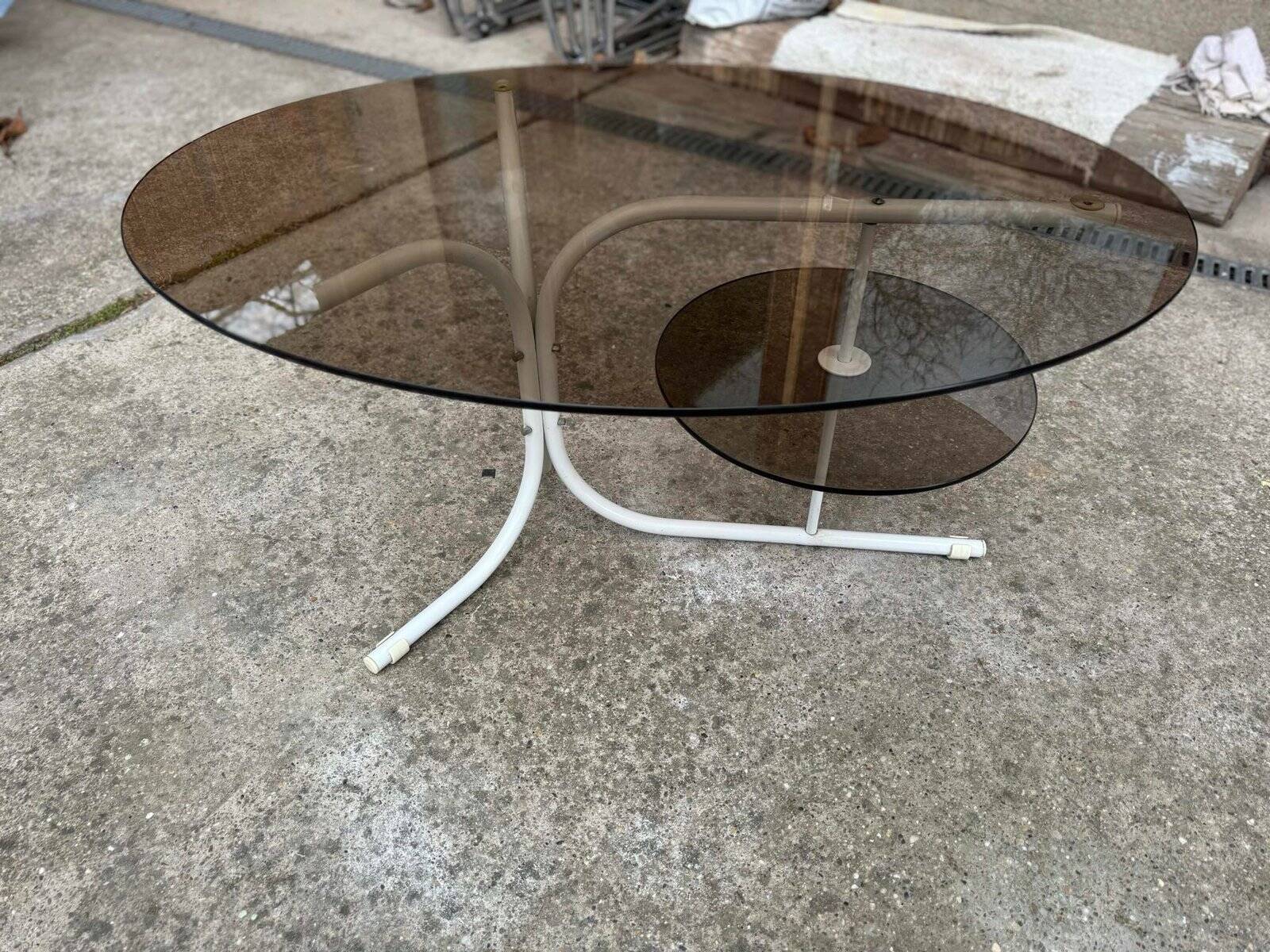 Oval smoked grey glass coffee table with white metal legs - 1990s vintage style.