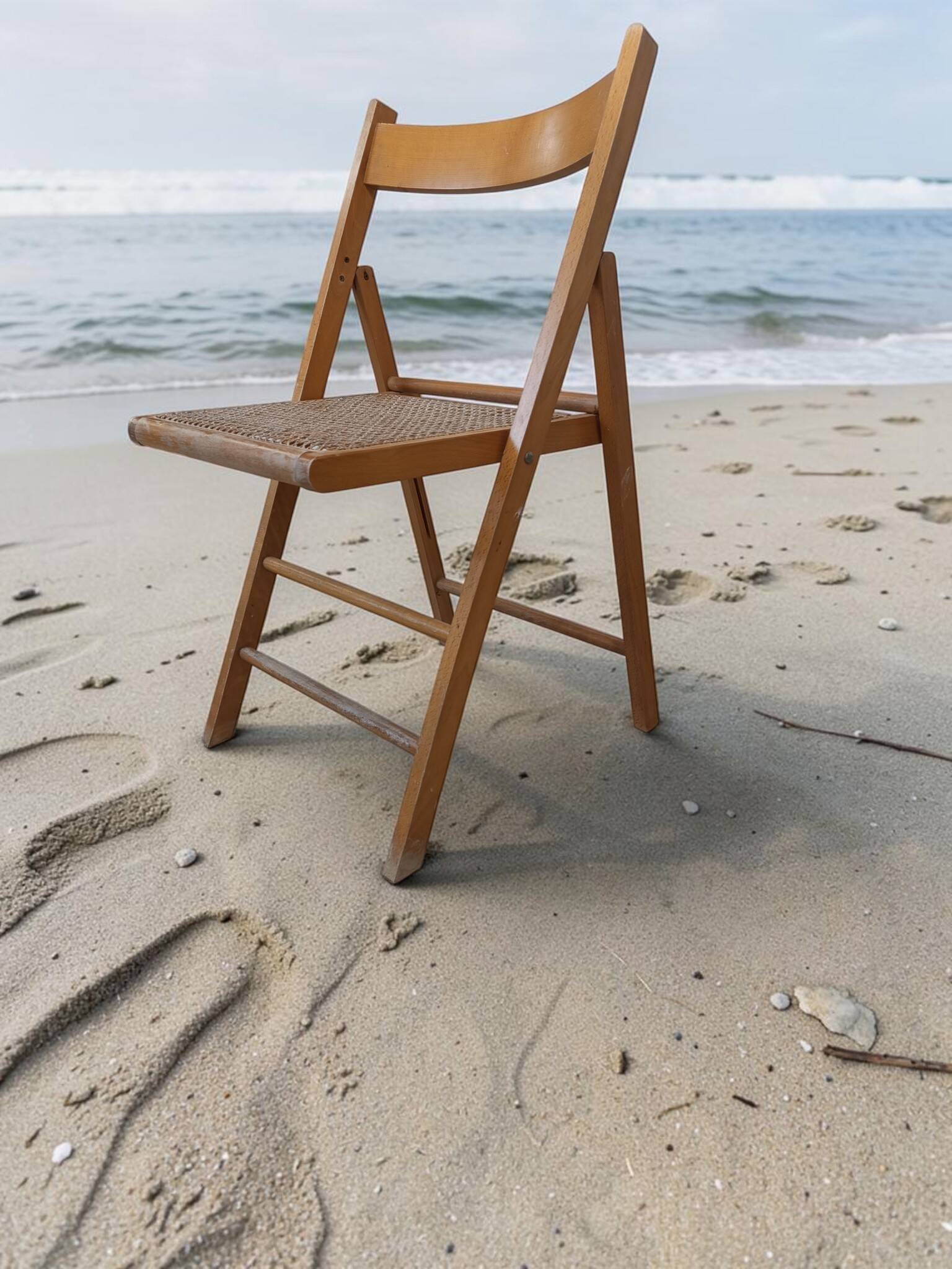 Vintage folding chair with caning.
