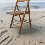 Vintage folding chair with caning.
